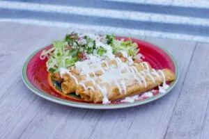 Flautas de Papa con Crema, Queso Cotija, Lechuga y Pico de Gallo