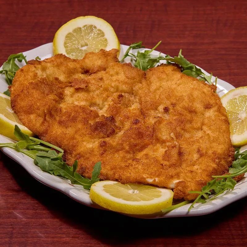 Chicken Milanese with arugula and lemon slices